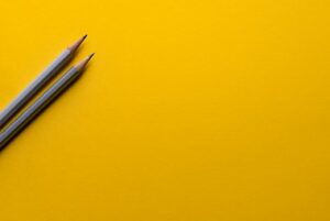 pencils on yellow background